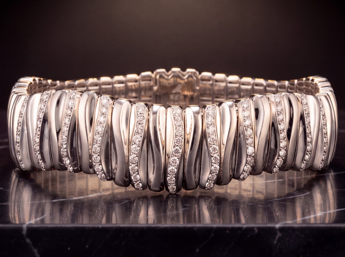 White gold and diamond bracelet on black marble, spot lit